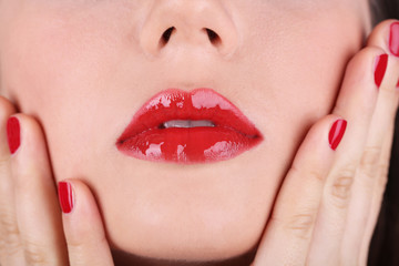 Red lips and nails closeup