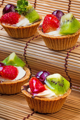 Mini fruit tart and wooden background