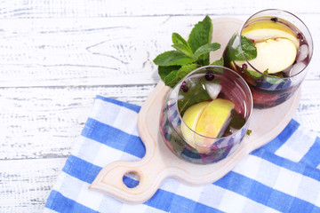 Tasty cocktail with fresh fruits and mint leaves
