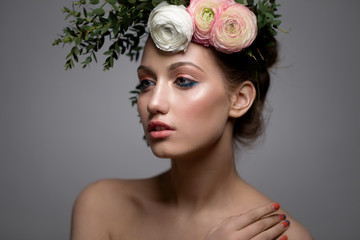 fashion model with  hairstyle and flowers in her hair.