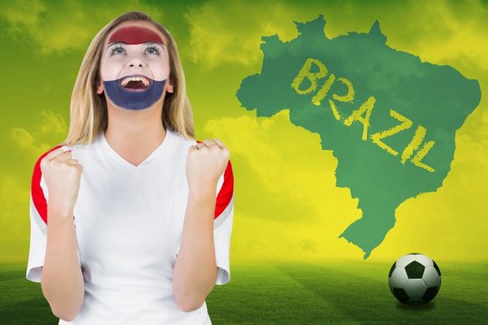 Excited netherlands fan in face paint cheering