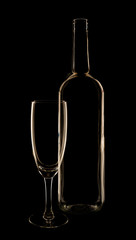 Glass and wine bottle