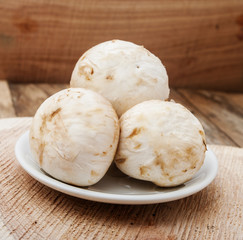 mushrooms on wooden background