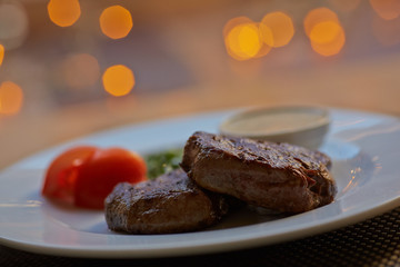 steak with sauce and vegetables