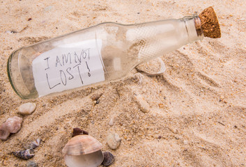 Concept image of a message I AM NOT LOST in a bottle