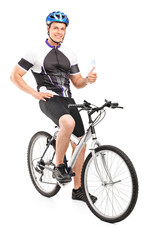 Obraz premium Male biker sitting on his bike