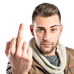 Young man doing the horn sign over white background