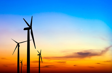 wind turbine silhouette on colorful sunset