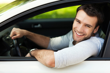 Young man sitting in a car