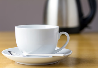 Cup of tea with kettle