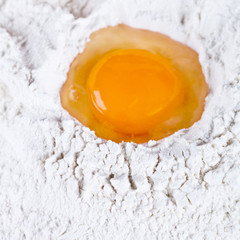 broken egg on flour