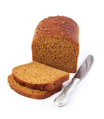 Loaf of rye bread with slices and knife