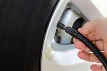 Filling air into a car tire