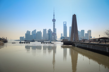 Fototapeta na wymiar shanghai skyline reflection in river
