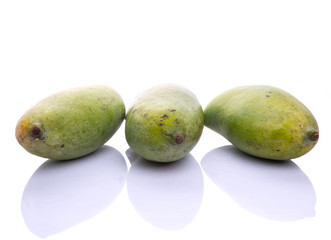 Green mango fruit over white background