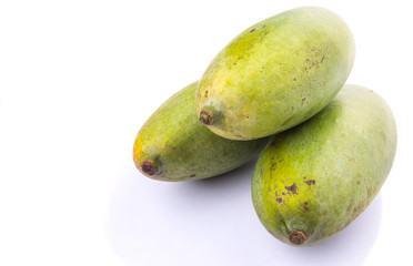 Green mango fruit over white background