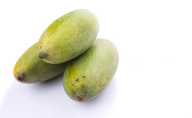 Green mango fruit over white background