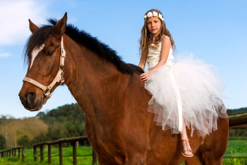Sweet girl riding horse.