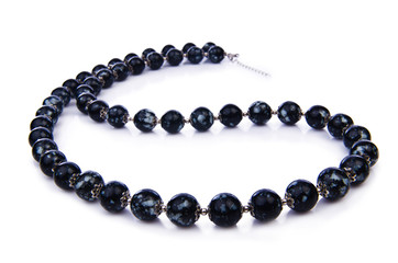 Dark pearl necklace isolated on the white