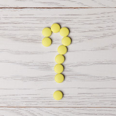 Question mark made of pills