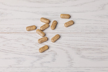 Pills on wooden table