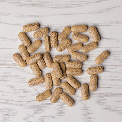 Pills on wooden table