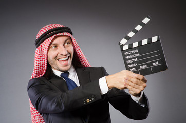 Arab businessman with movie board