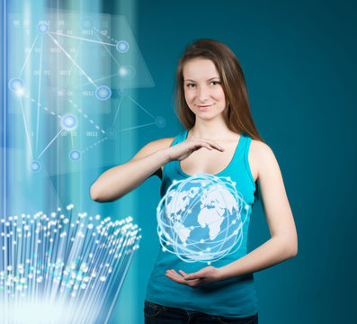 Girl holding glowing earth globe in her hands. Internet.