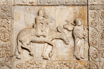 Fototapeta na wymiar Verona - Relief of Flight to Egypt from of Basilica San Zeno