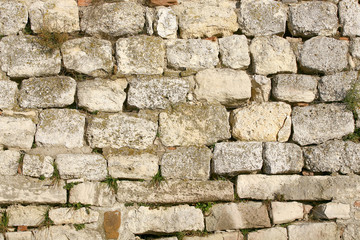 Fototapeta premium Antique natural stonewall for background or texture