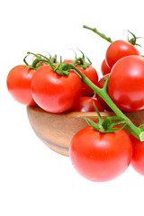Branch of tomatoes isolated on white background