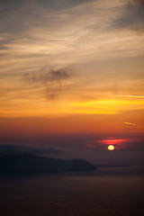 Fototapeta na wymiar Misty Sunset over Greek Islands