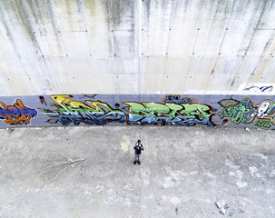 Graffiti on wall and boy