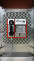 the public pay phone close up, phone and headset