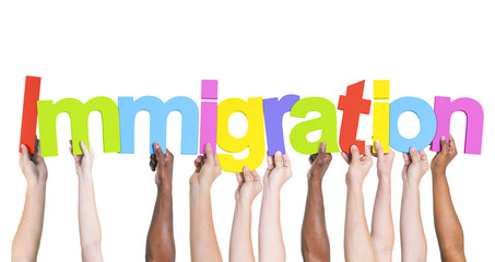 Diverse Hands Holding the Word Immigration - obrazy, fototapety, plakaty