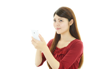 Fototapeta premium スマートフォンを持つ女性