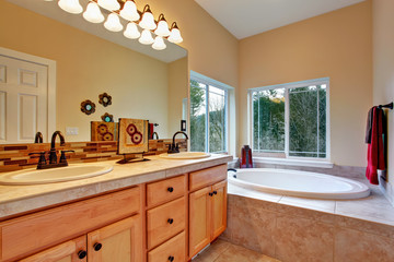 Bathroom with whirlpool and window view