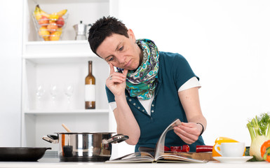 Fototapeta na wymiar woman looking for cooking recipe
