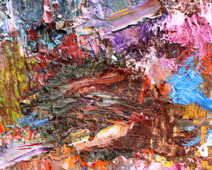 Abstract background mixing oil paints on a palette.