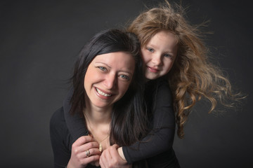 portrait of playful girl  with her mother