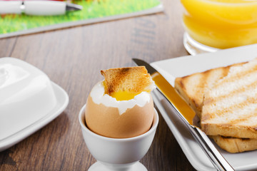 Fototapeta premium soft-boiled egg Breakfast with toasts