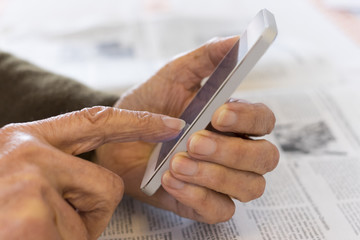Senior woman Using mobile phone at home