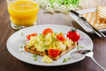 scrambled eggs breakfast with toasts