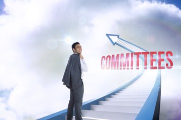 Fototapeta premium Committees against red staircase arrow pointing up against sky