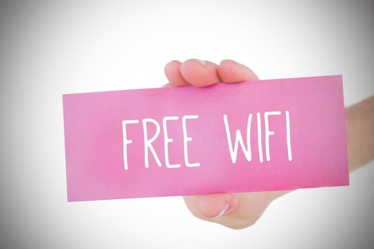 Woman Holding Pink Card Saying Free Wifi