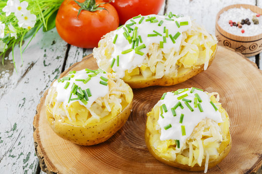 whole baked potato with cheese and sauce