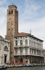 Fototapeta na wymiar Bel Tower by Old Venice Building