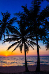 Naklejka na ściany i meble Beautiful sunset at a beach resort in tropics
