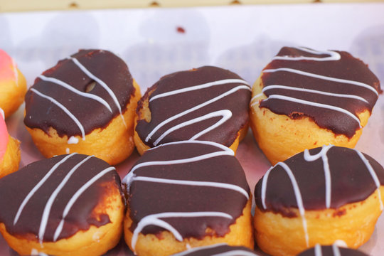 A lot of tasty chocolate donuts