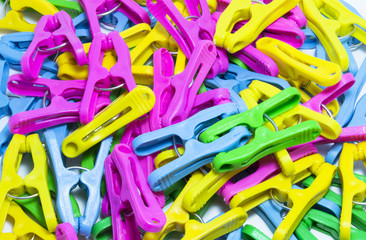 plastic clothes pegs on a white background